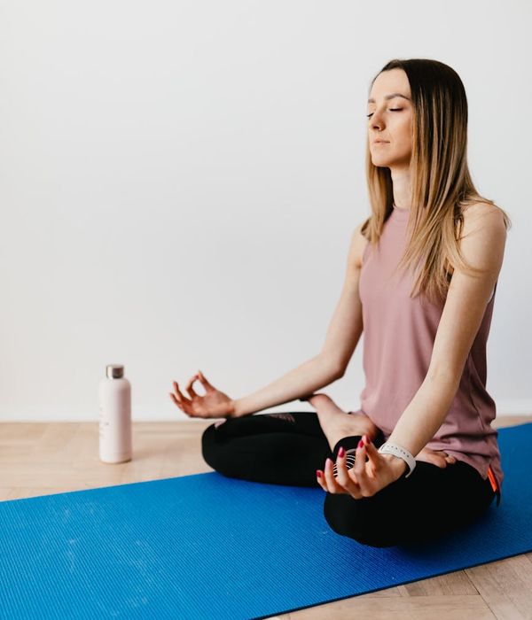 Woman with calm expression focusing, embodying mental clarity.